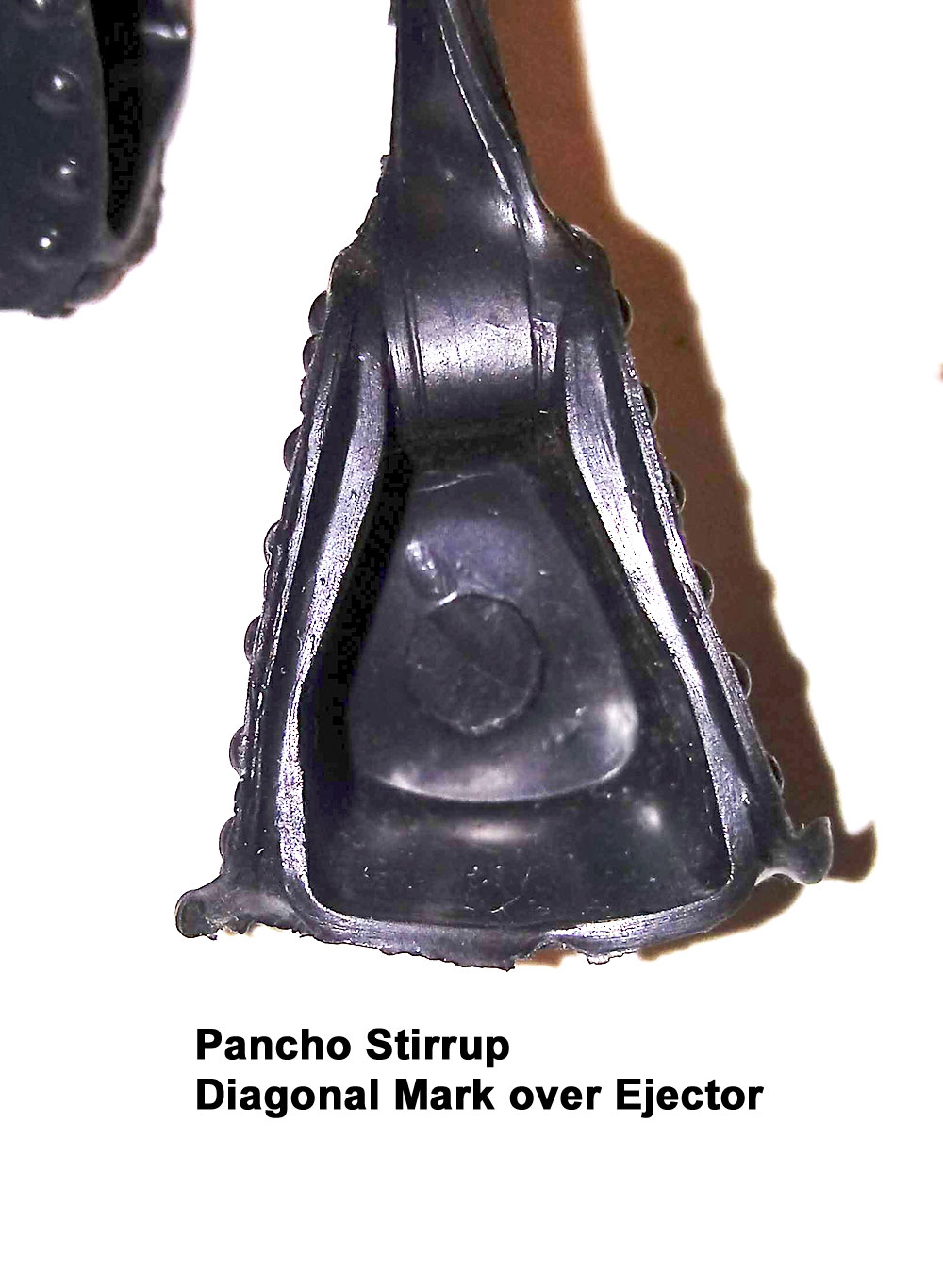 Pancho Stirrup, No Number, All Pancho Stirrups have 1 large ejector pin mark inside the stirrup. Through the Ejector pin mark you can see a Diagonal Mark from the upper left through the ejector pin circle.