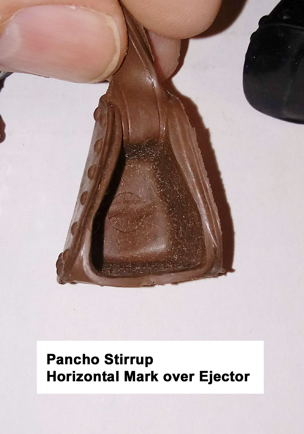 Pancho Stirrup, No Number, All Pancho Stirrups have 1 large ejector pin mark inside the stirrup. Through the Ejector pin mark you can see a Single Horizontal Mark from the left through the ejector pin circle.