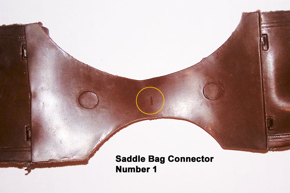 Saddle Bag Connector, Number 1, All Connector Cavities had 2 large ejector pins under the connector.