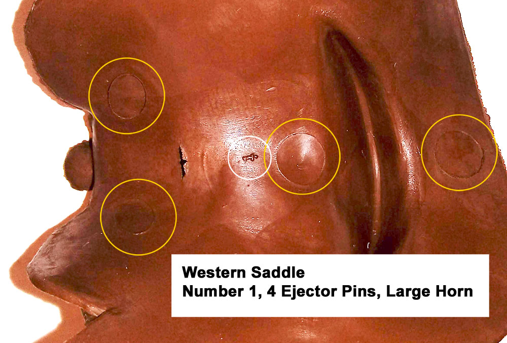 Western Saddle with large saddle horn, Number 1 (small font), Cavity had 2 large ejector pins under the seat and rear of the saddle, and 2 smaller ones on the forward part of the saddle.